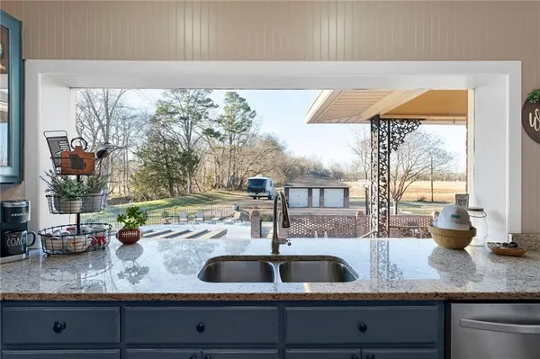 a stove top oven sitting inside of a kitchen