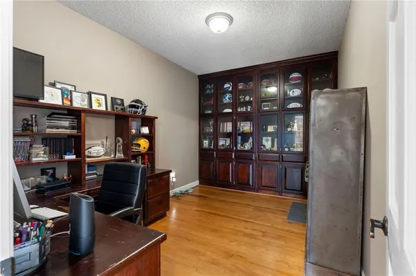 a view of a dining room with furniture large windows and wooden floor