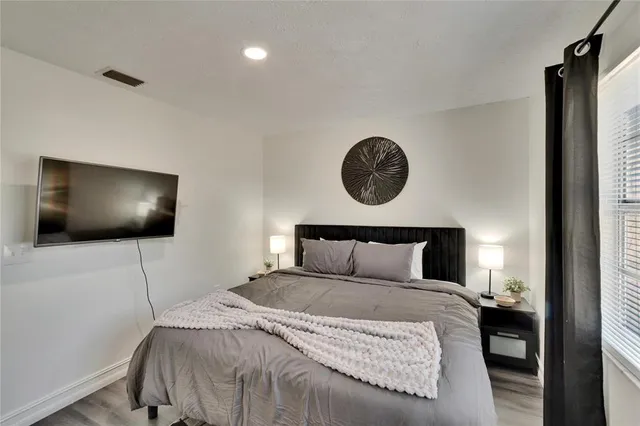 a living room with furniture and a dining table