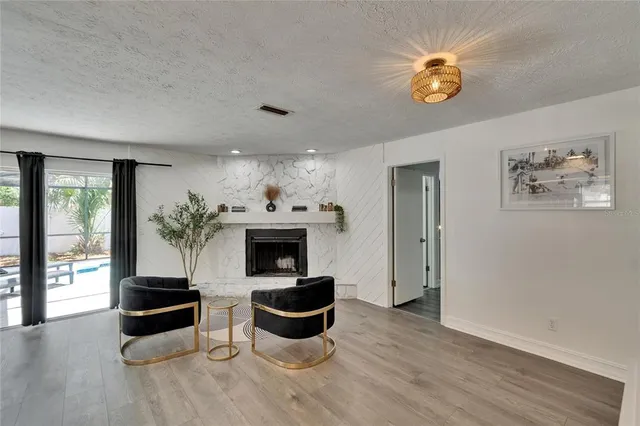 a view of a dining room with furniture and window