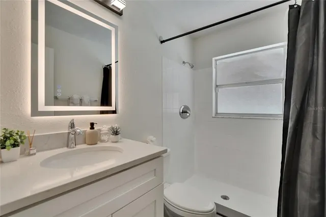 a view of a backyard with swimming pool