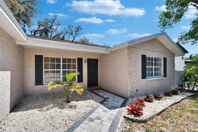 a view of chair and a bench in the patio