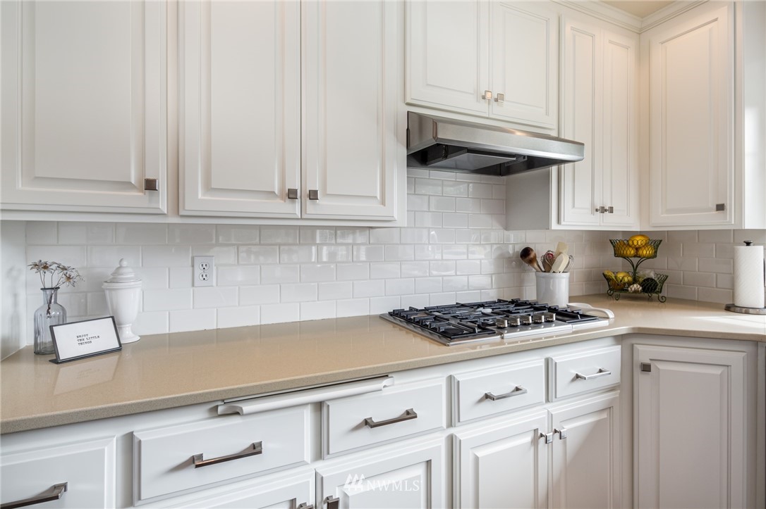 5044 Mission Road Bellingham, WA 98226 - Photo 14 of 40 a kitchen with white cabinets and white appliances