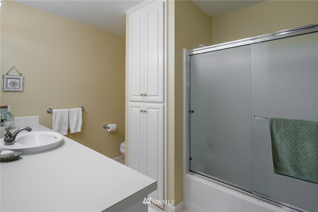 5044 Mission Road Bellingham, WA 98226 - Photo 23 of 40 a bathroom with a sink and shower