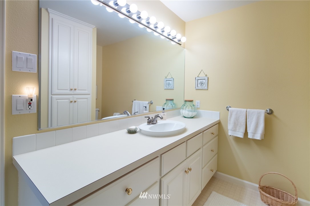 5044 Mission Road Bellingham, WA 98226 - Photo 24 of 40 a bathroom with a sink and a mirror