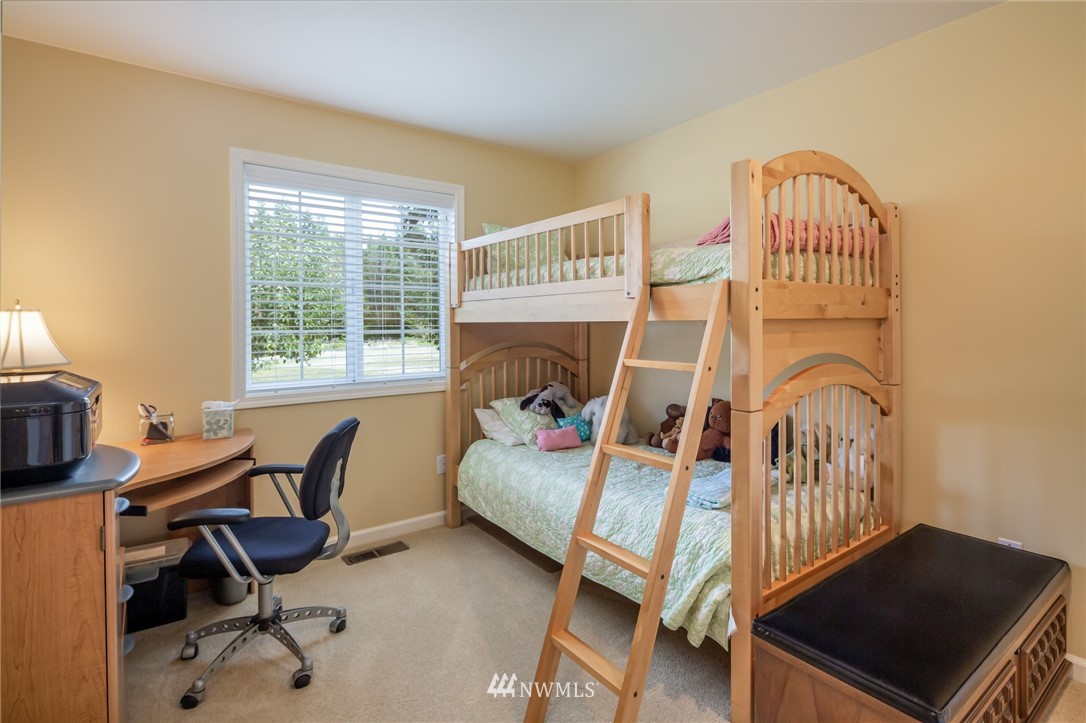 5044 Mission Road Bellingham, WA 98226 - Photo 26 of 40 a bedroom with furniture and a window