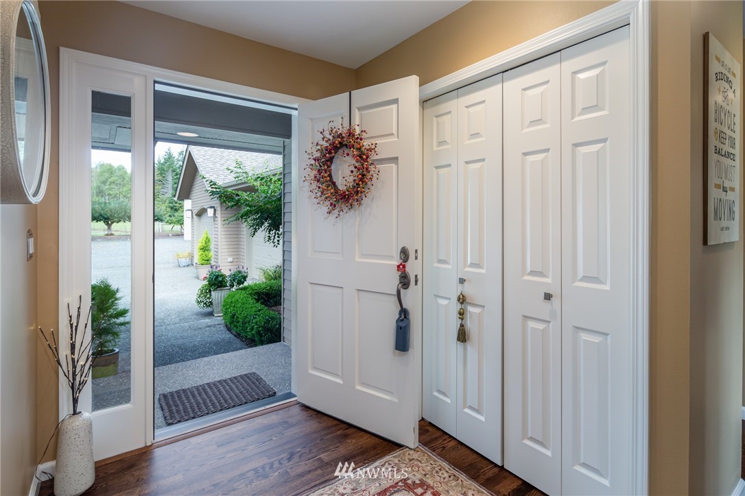 5044 Mission Road Bellingham, WA 98226 - Photo 4 of 40 a view of a hallway with wooden floor and front door