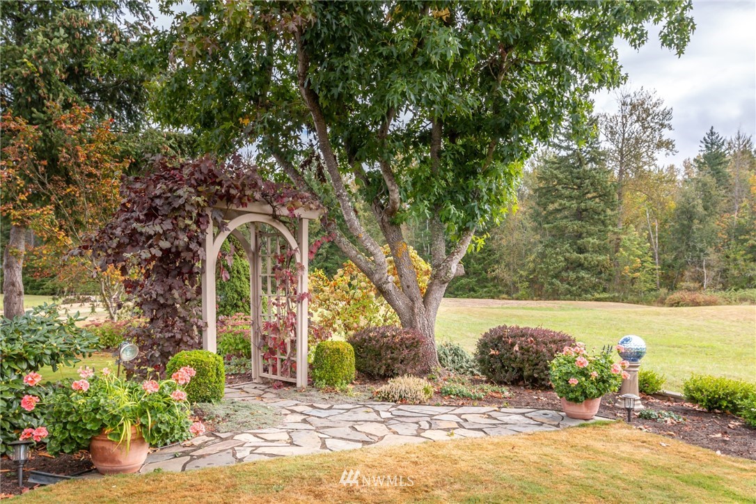 5044 Mission Road Bellingham, WA 98226 - Photo 36 of 40 a view of a garden with a tree
