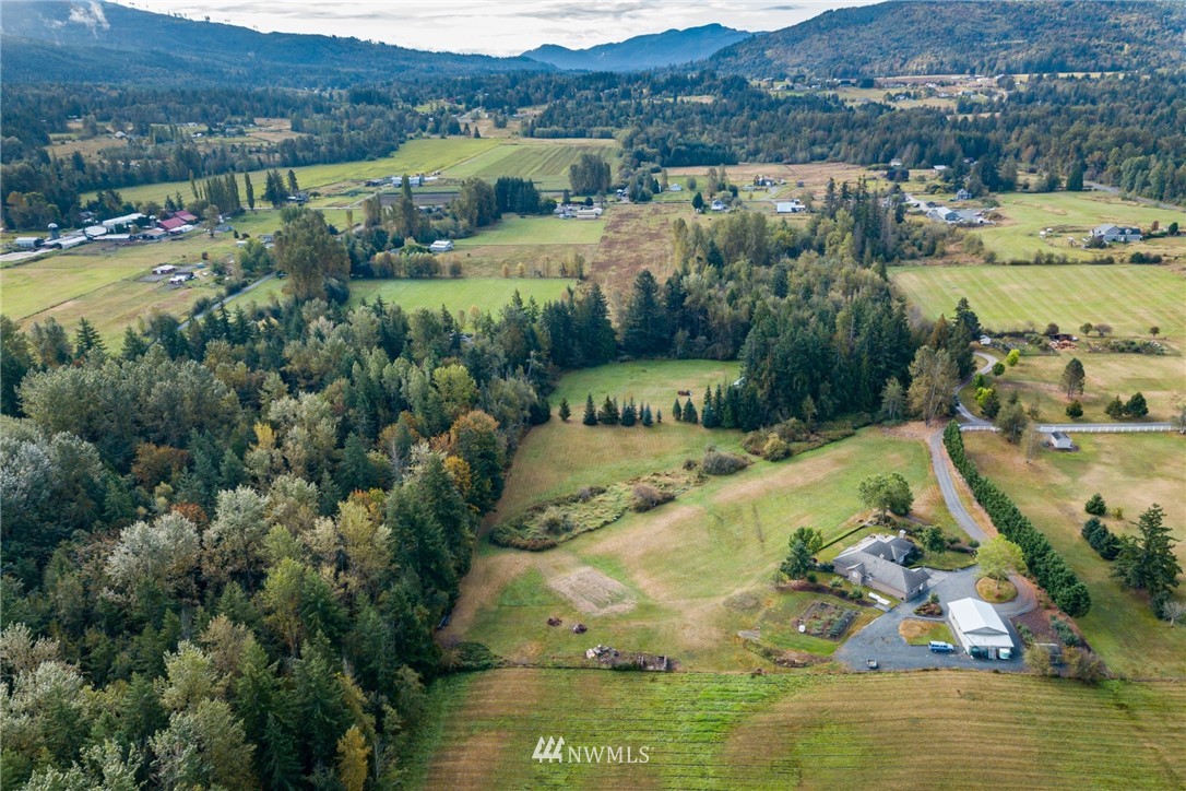 5044 Mission Road Bellingham, WA 98226 - Photo 39 of 40 an aerial view of house with yard swimming pool and mountains