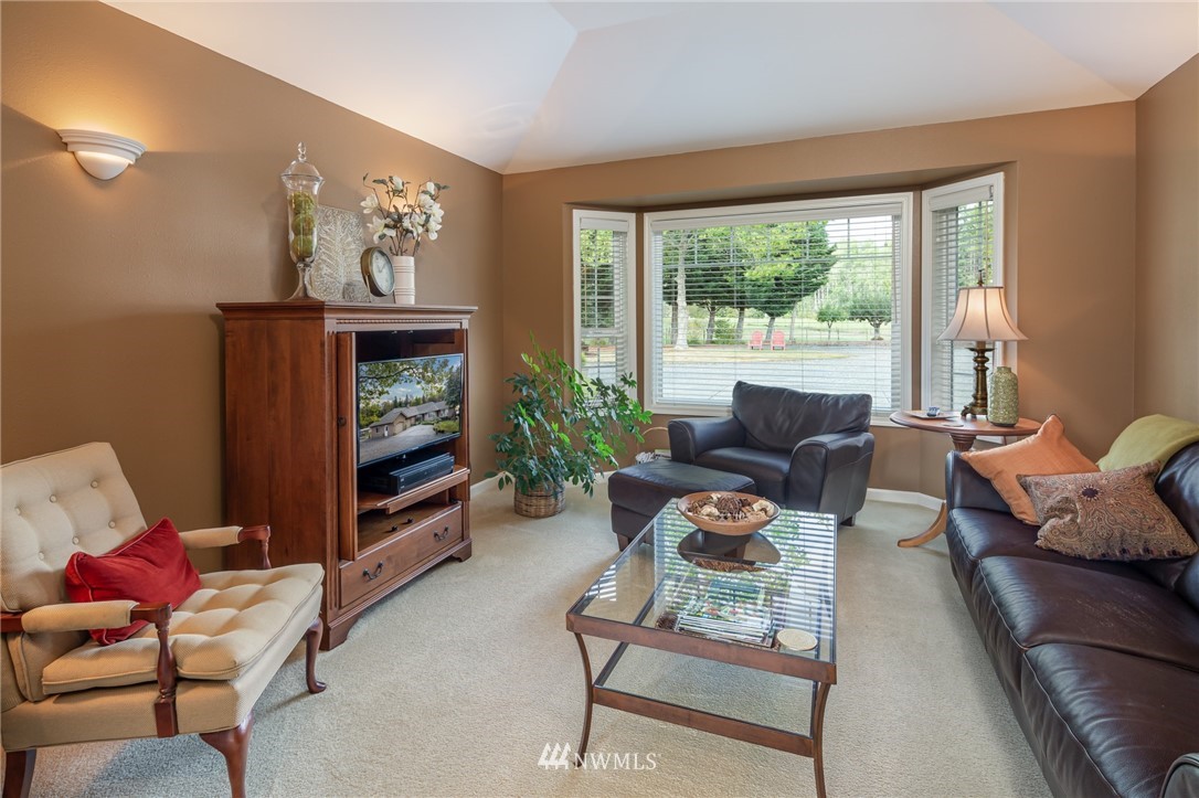 5044 Mission Road Bellingham, WA 98226 - Photo 5 of 40 a living room with furniture and a fireplace