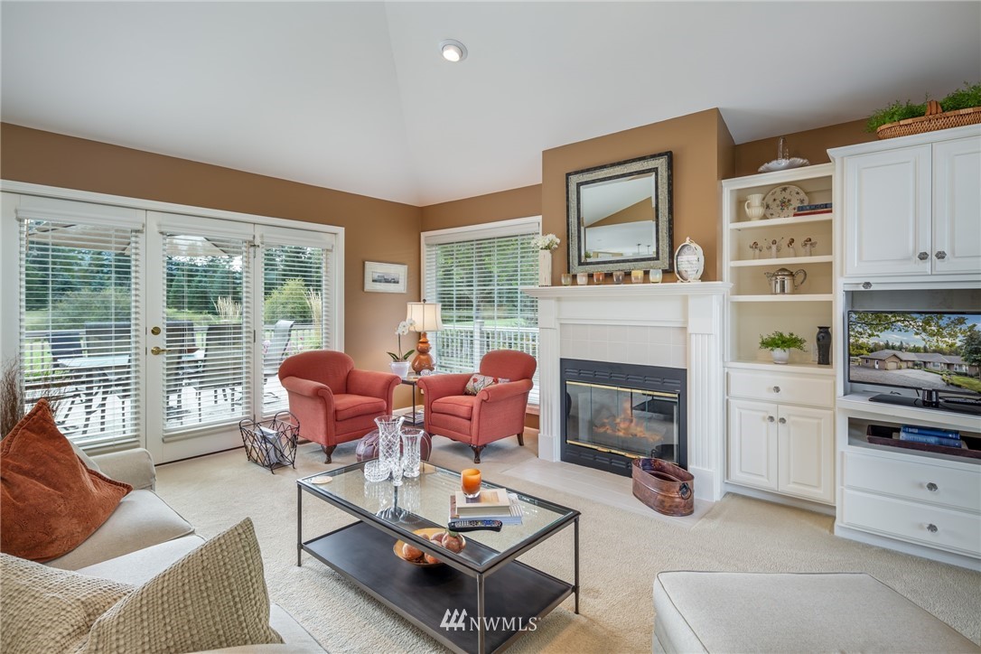 5044 Mission Road Bellingham, WA 98226 - Photo 8 of 40 a living room with furniture fireplace and a large window