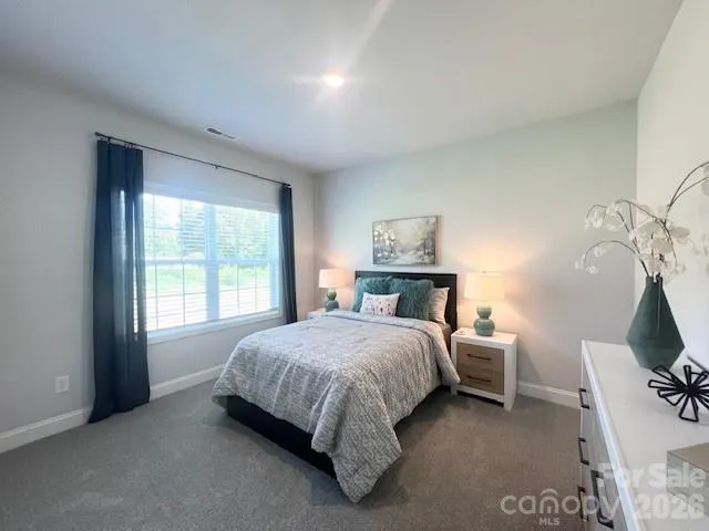 a view of hallway with wooden floor