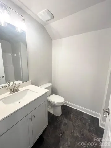 a view of hallway with wooden floor