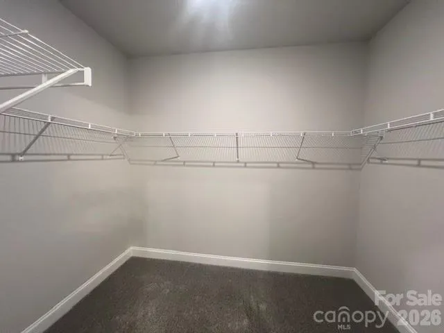 a bathroom with a glass door shower a sink and a mirror