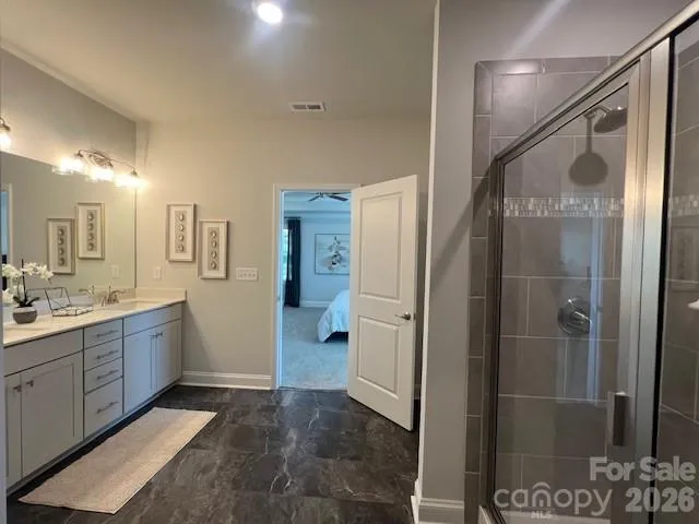 a living room with furniture a fireplace and a large window