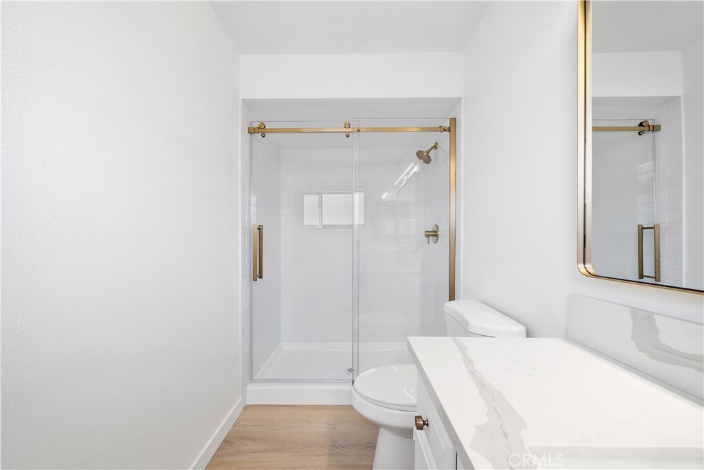 5510 Las Virgenes Road Calabasas, CA 91302 - Photo 12 of 16 a bathroom with a sink a toilet and shower