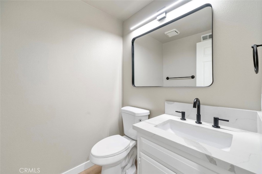 5510 Las Virgenes Road Calabasas, CA 91302 - Photo 13 of 16 a bathroom with a toilet a sink and mirror