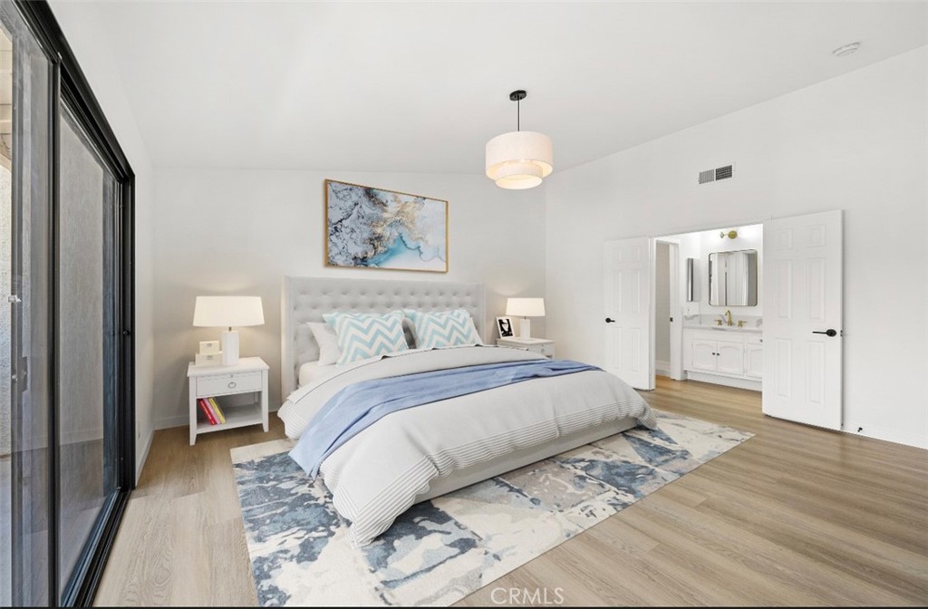 5510 Las Virgenes Road Calabasas, CA 91302 - Photo 6 of 16 a bedroom with a bed and painting on the wall