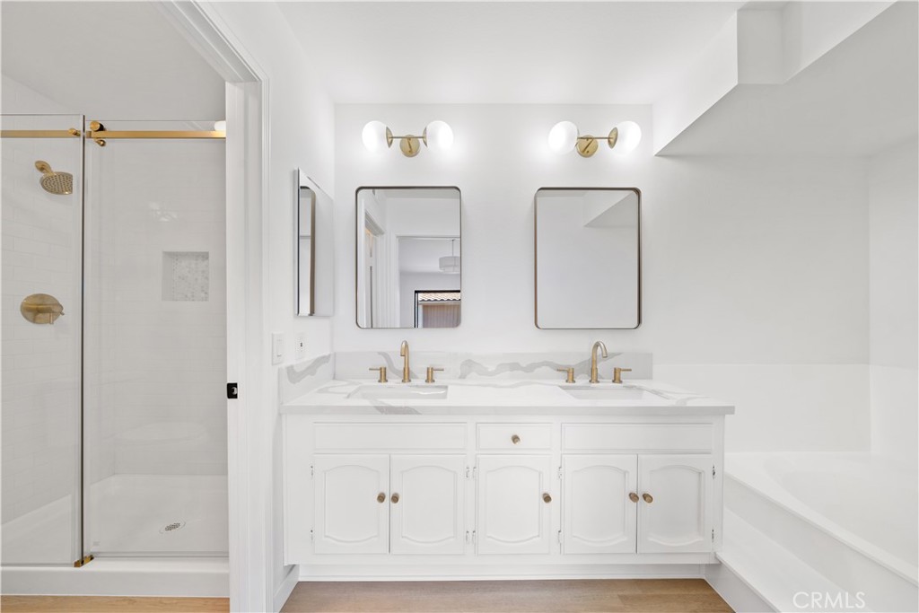 5510 Las Virgenes Road Calabasas, CA 91302 - Photo 8 of 16 a bathroom with a double vanity sink mirror and shower