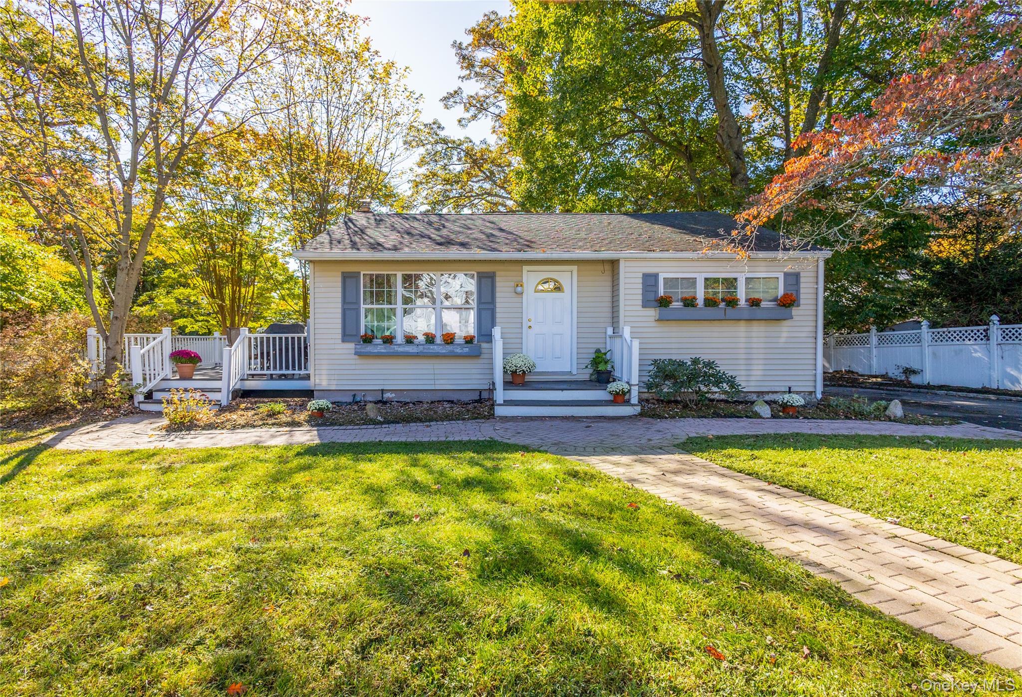 a view of house with swimming pool and furniture
