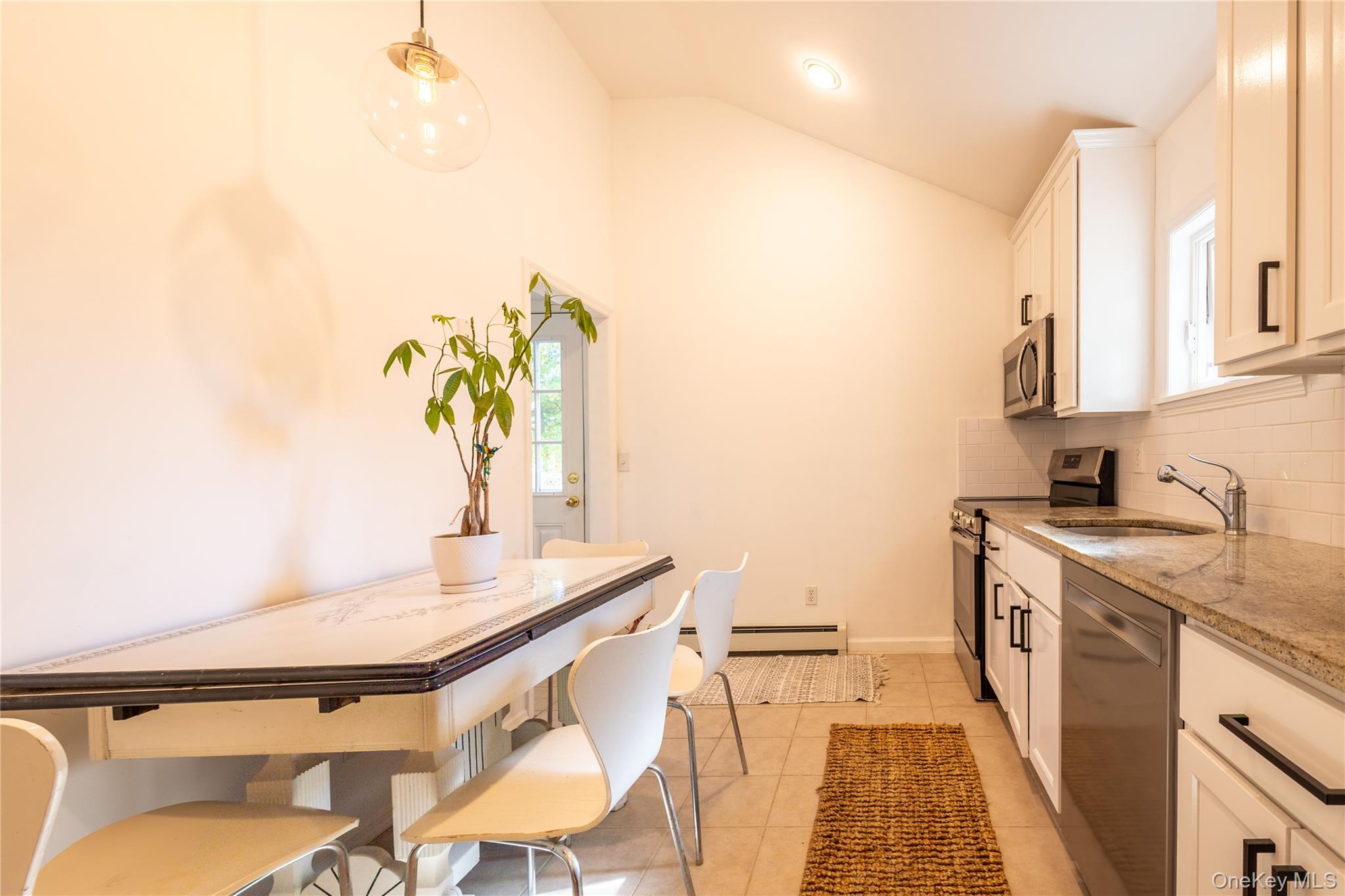 50 Prince Road Rocky Point, NY 11778 - Photo 10 of 30 a kitchen with a sink appliances and cabinets