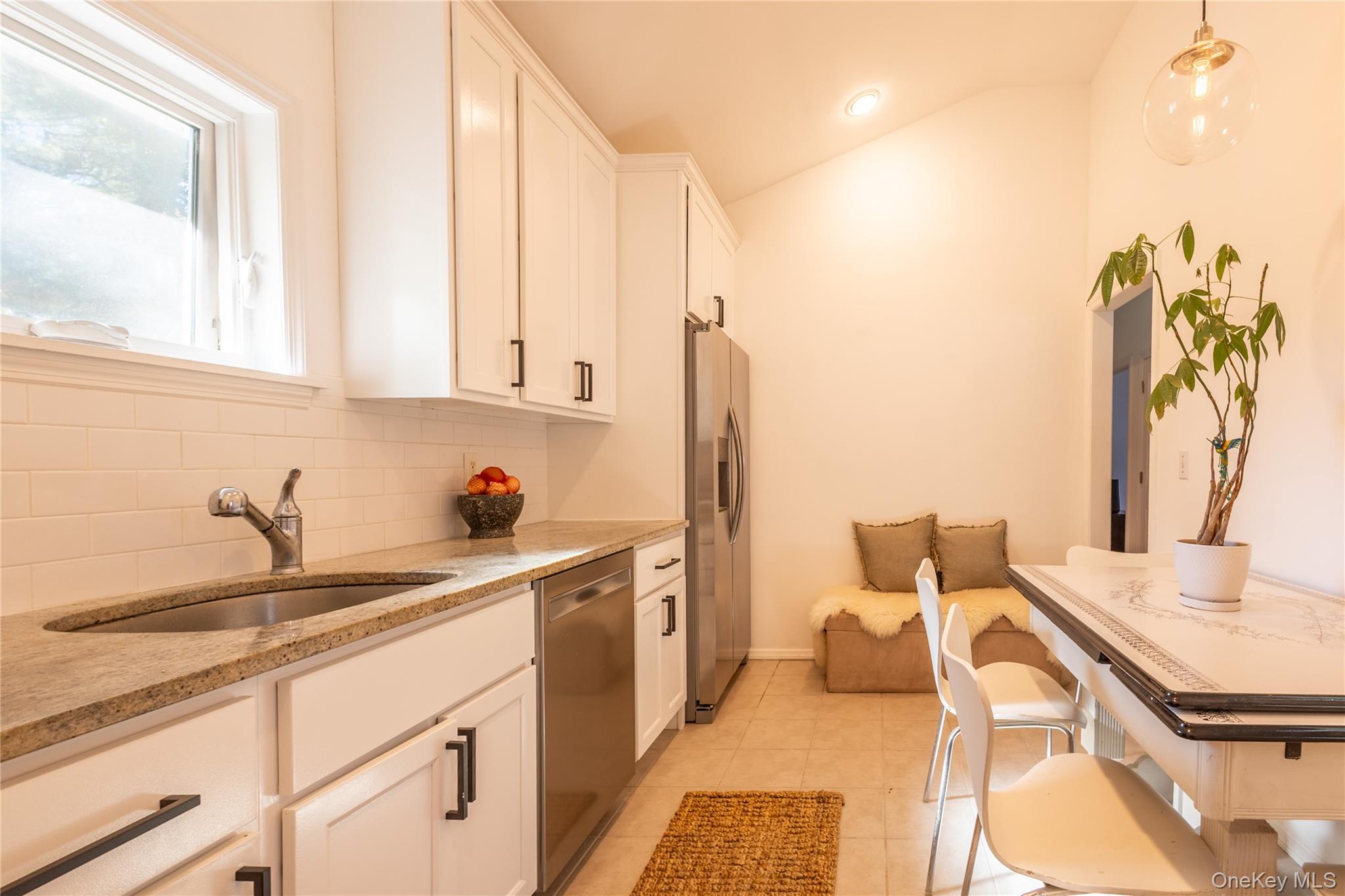 50 Prince Road Rocky Point, NY 11778 - Photo 11 of 30 a kitchen with a sink and cabinets
