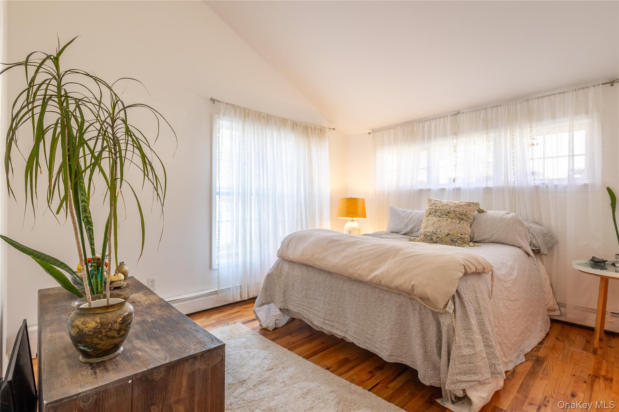 50 Prince Road Rocky Point, NY 11778 - Photo 13 of 30 a spacious bedroom with a bed and window