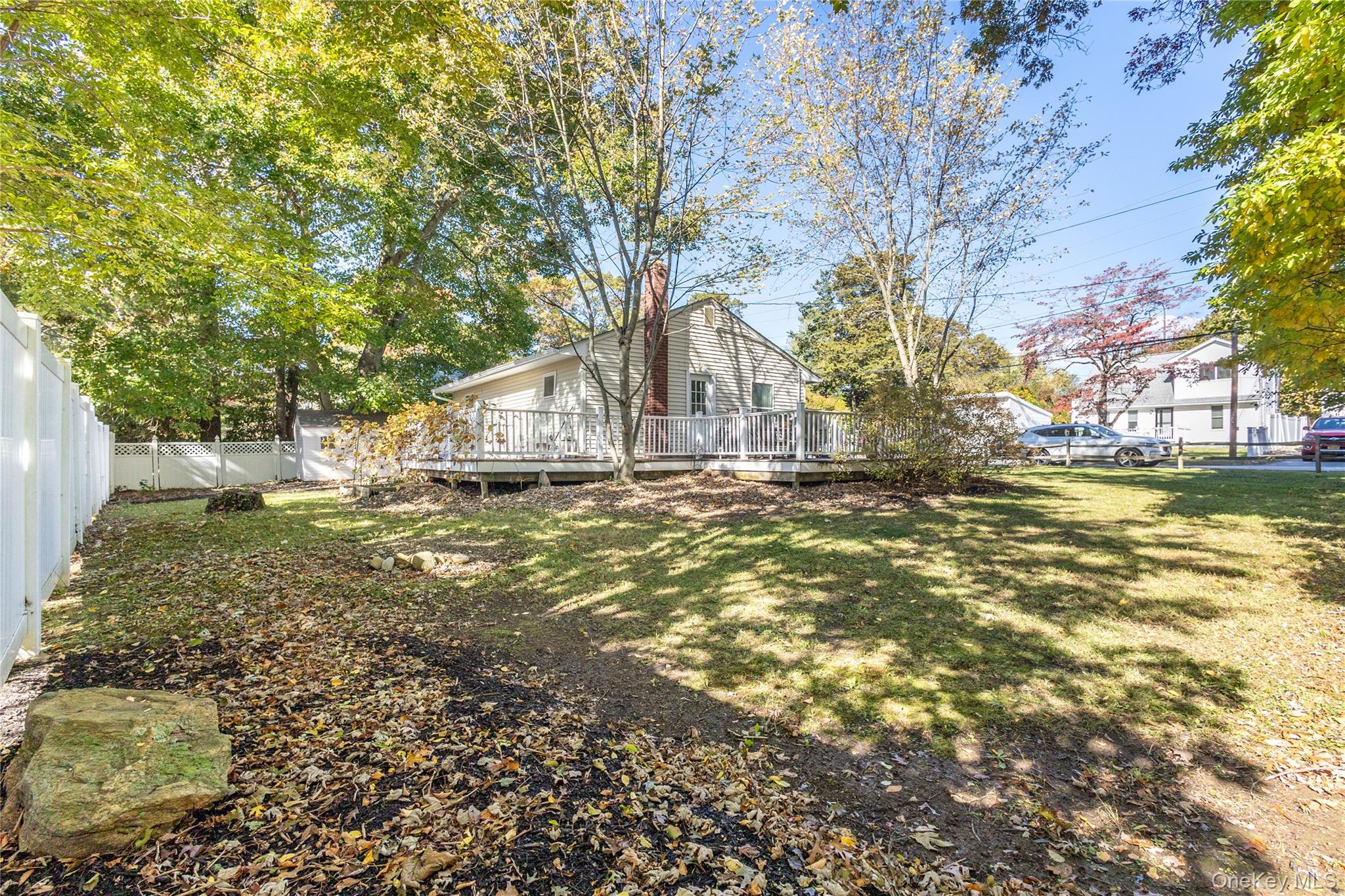 50 Prince Road Rocky Point, NY 11778 - Photo 22 of 30 a house with trees in front of it