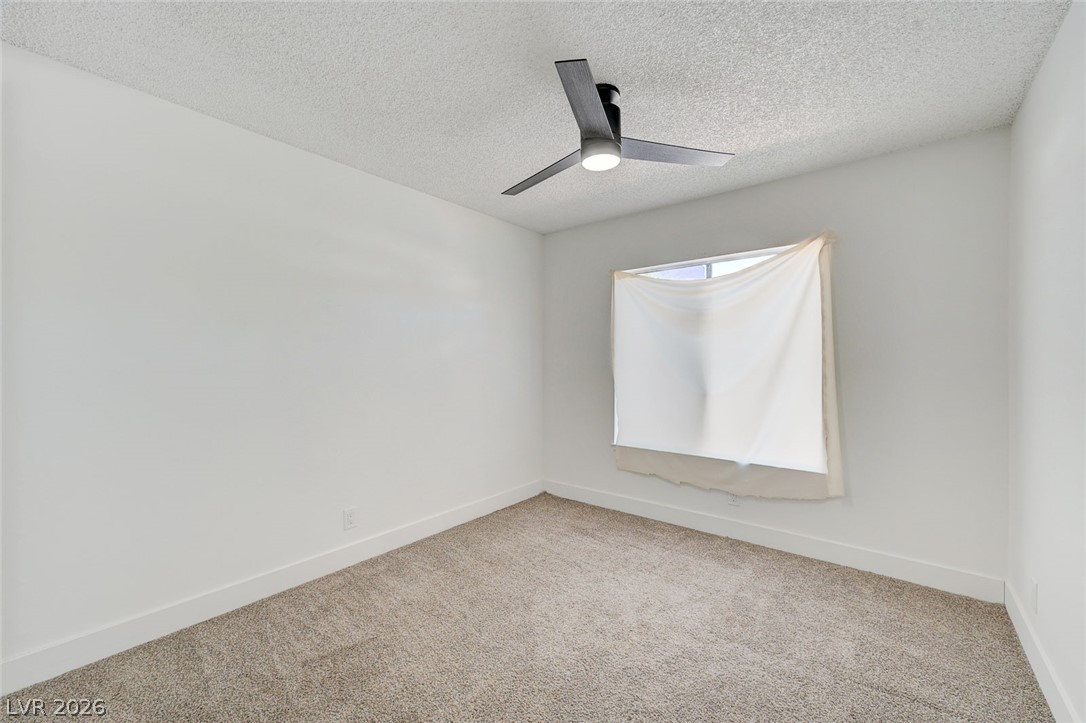 4840 Summerhill Road Las Vegas, NV 89121 - Photo 32 of 56 Minimalist design and ample floor space define this comfortable, well-lit bedroom two.