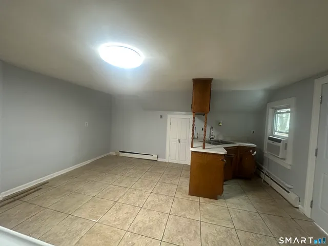 a kitchen with a cabinets and window