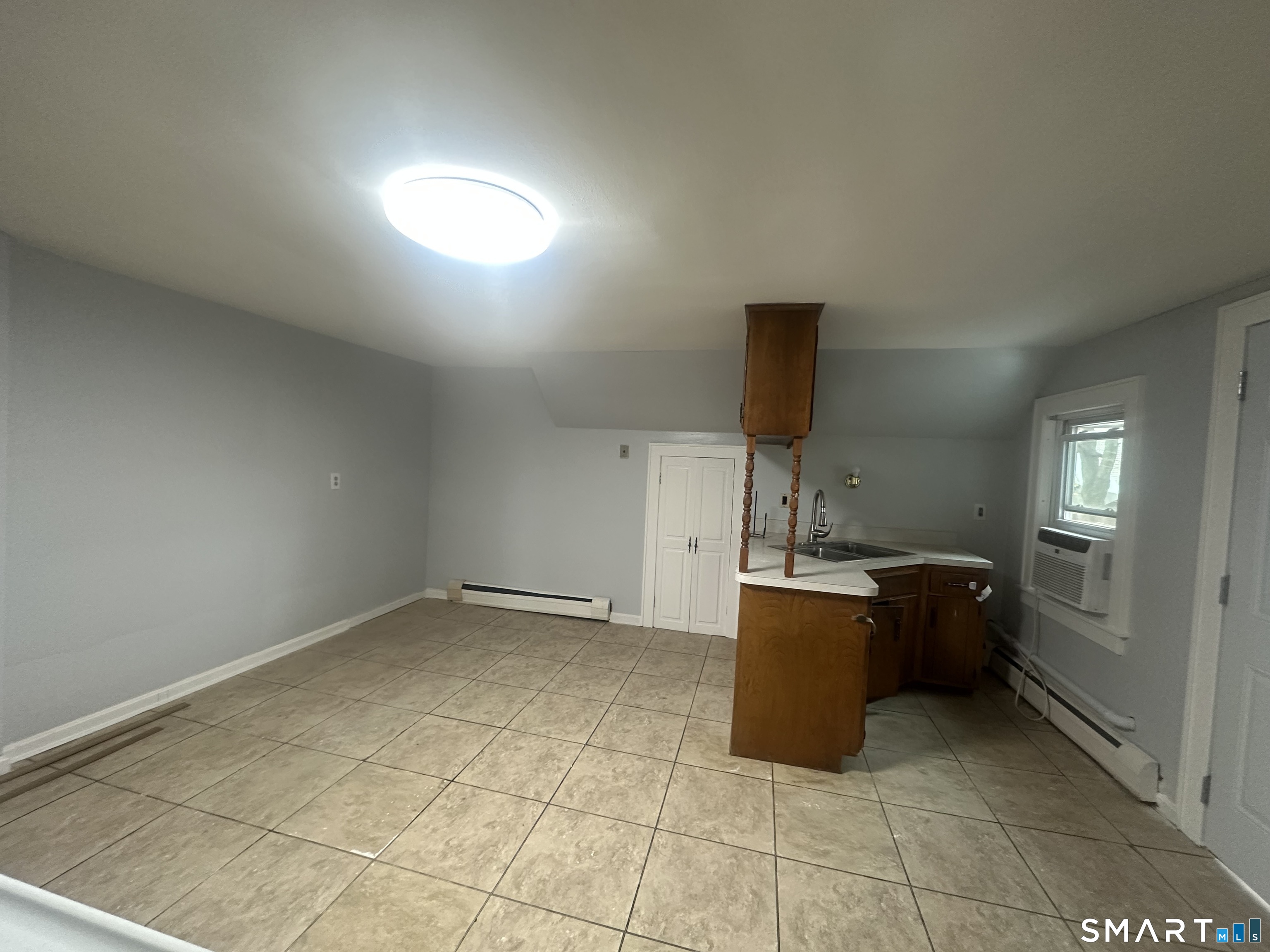 33 Emory Court Bristol, CT 06010 - Photo 4 of 11 a kitchen with a cabinets and window