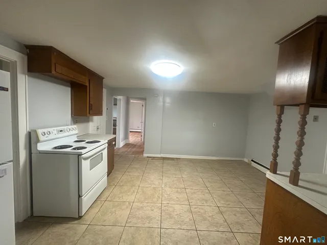 a kitchen with a stove and a refrigerator