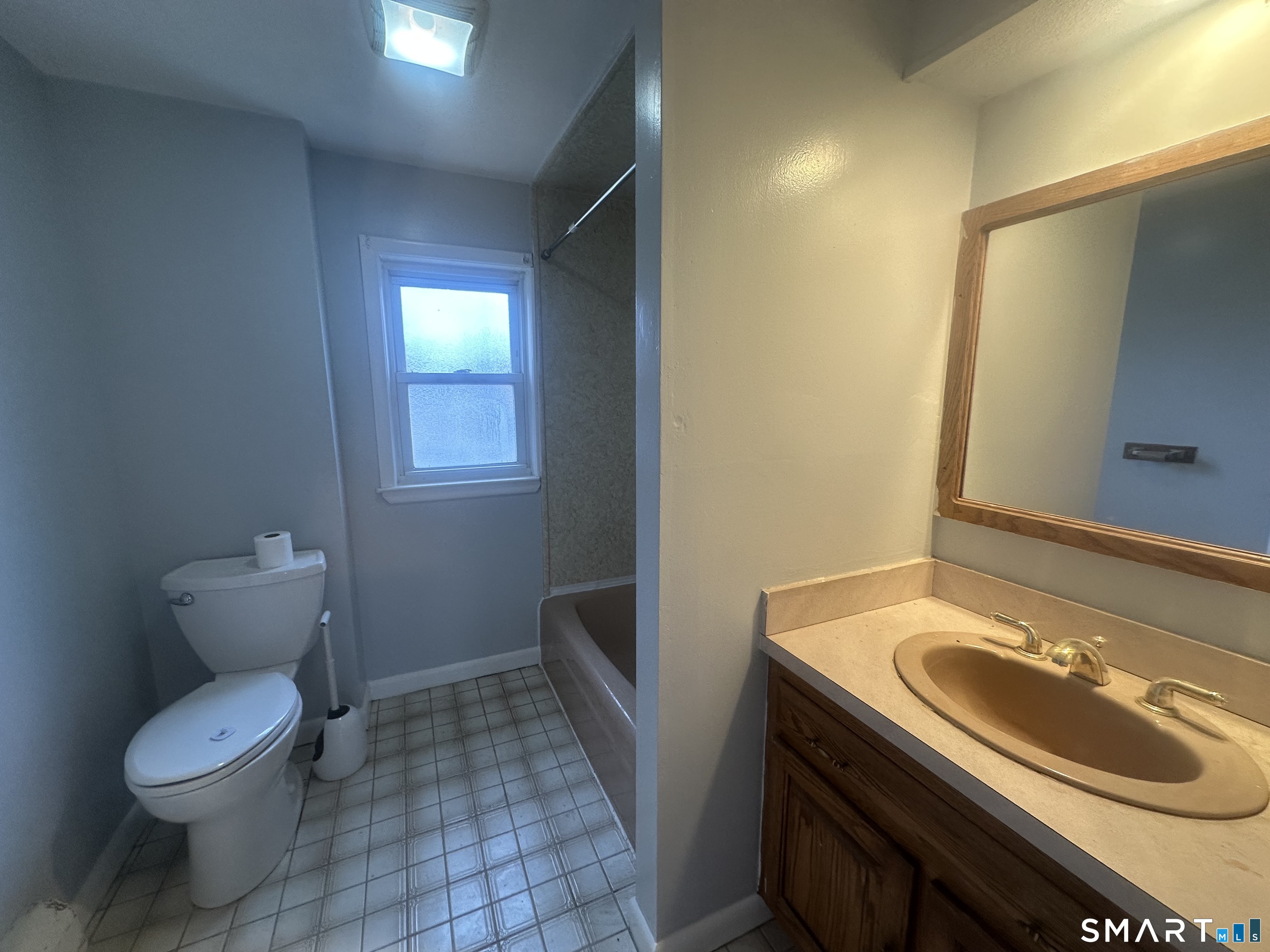 33 Emory Court Bristol, CT 06010 - Photo 6 of 11 a bathroom with a sink toilet and mirror