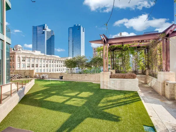 a view of swimming pool with a patio