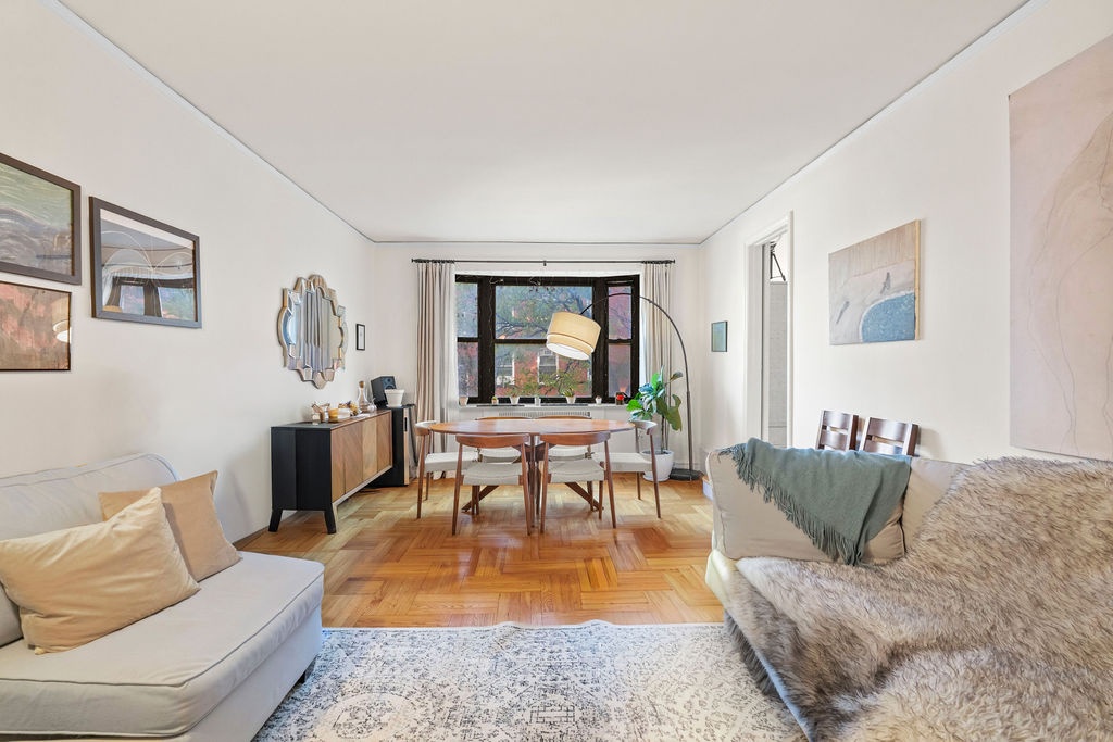 225 East 74th Street, Unit 3F Manhattan, NY 10021 - Photo 1 of 11 a living room with furniture and a a dining table