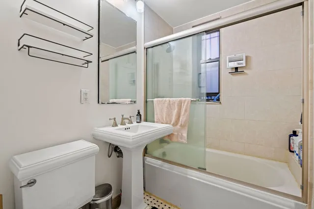 a bathroom with a sink a toilet and a bathtub