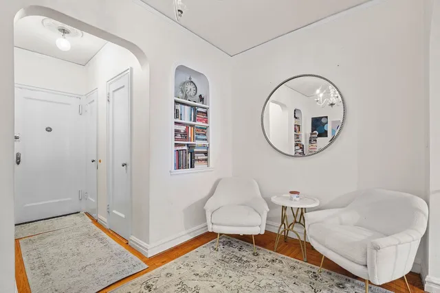 a living room with furniture and a rug