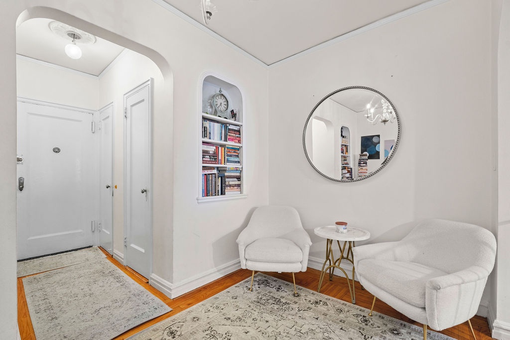 225 East 74th Street, Unit 3F Manhattan, NY 10021 - Photo 3 of 11 a living room with furniture and a rug