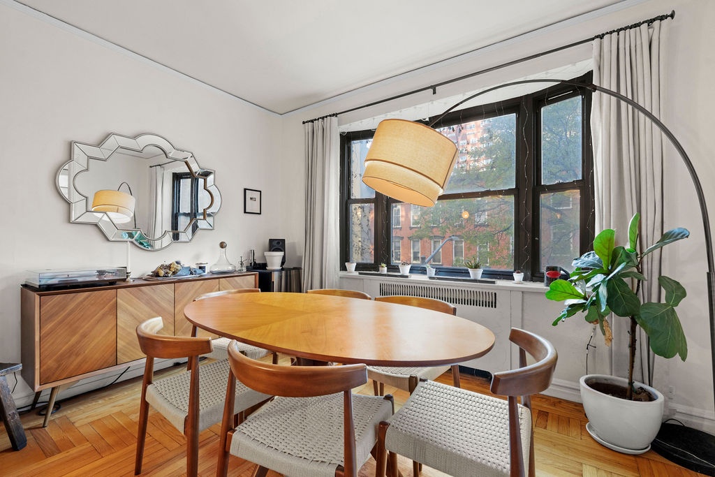 225 East 74th Street, Unit 3F Manhattan, NY 10021 - Photo 5 of 11 a dining room with furniture and window