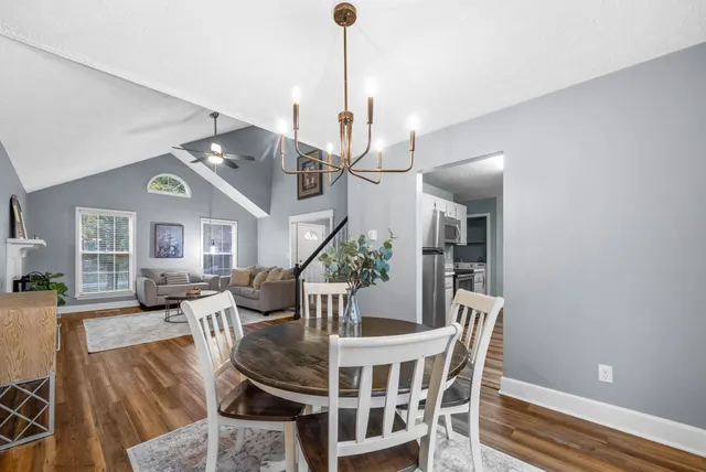 a kitchen with stainless steel appliances granite countertop a sink and cabinets