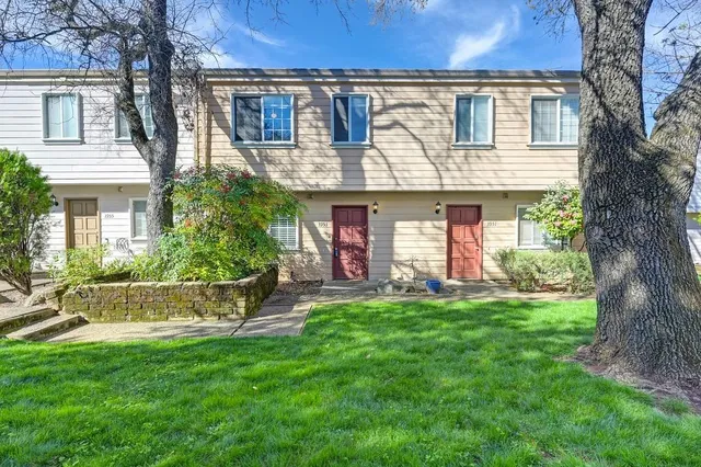 front view of a house with a yard