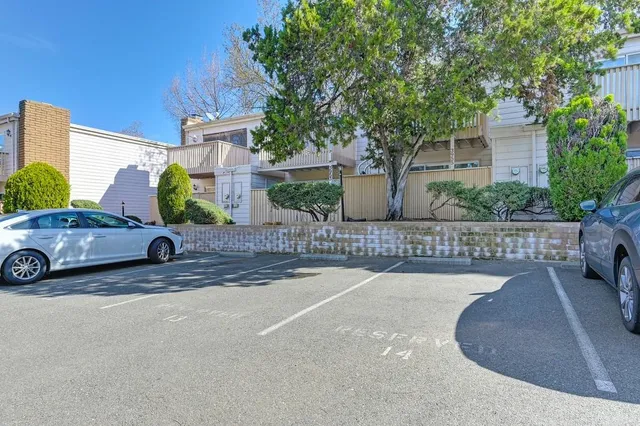 a view of a car parked in front of a house