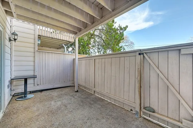 a view of a porch with wooden floor