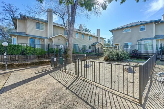 a view of a house with a iron gate