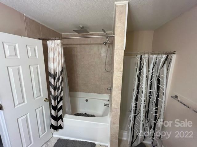 11047 Pointer Ridge Drive Charlotte, NC 28214 - Photo 17 of 26 a bathroom with a shower and a sink
