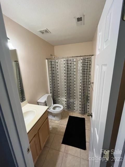 11047 Pointer Ridge Drive Charlotte, NC 28214 - Photo 19 of 26 a bathroom with a sink toilet and shower