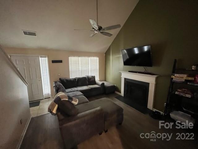 11047 Pointer Ridge Drive Charlotte, NC 28214 - Photo 3 of 26 a living room with furniture a flat screen tv and a fireplace