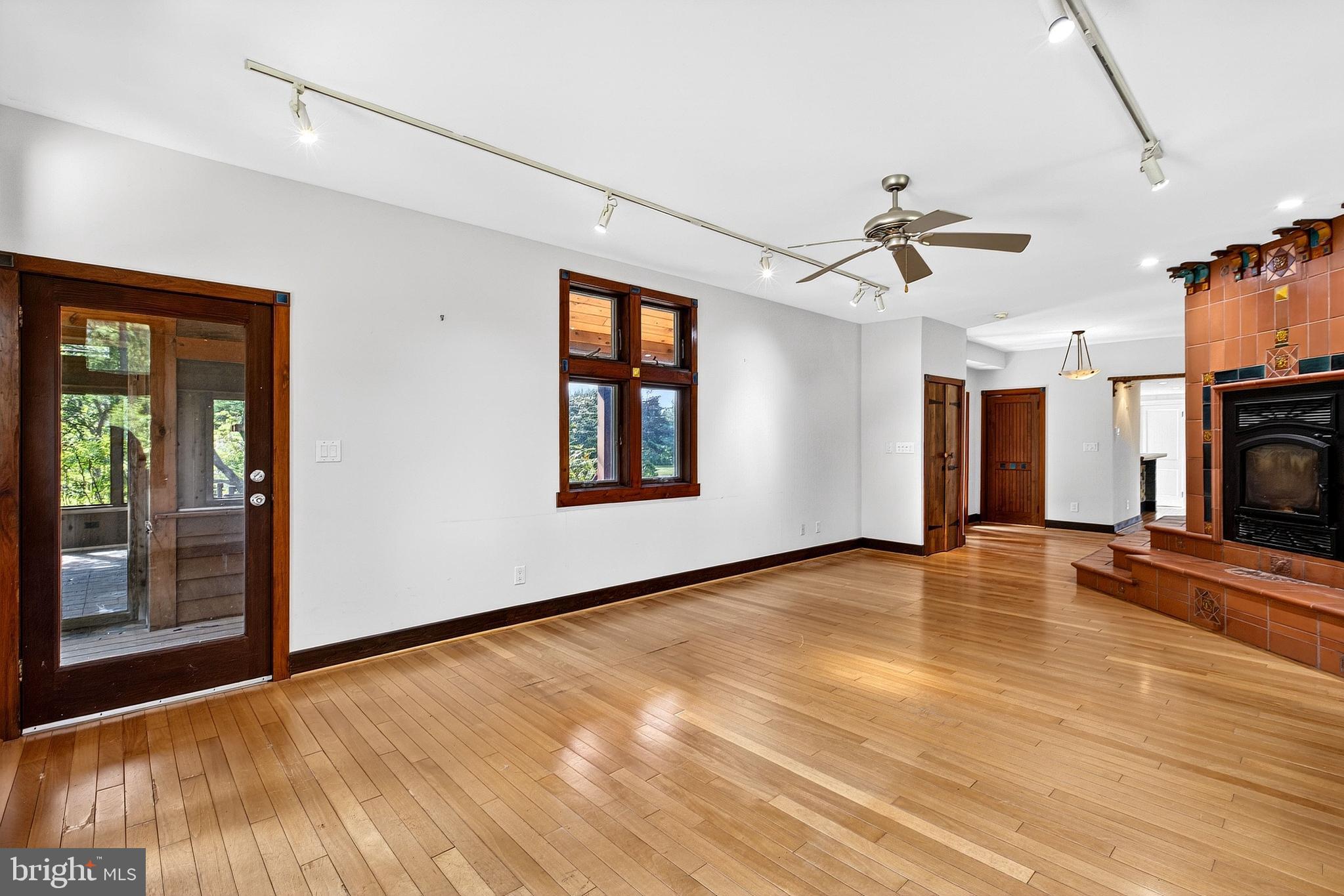498 Perrineville Road Robbinsville, NJ 08691 - Photo 21 of 59 a view of empty room with wooden floor and fan