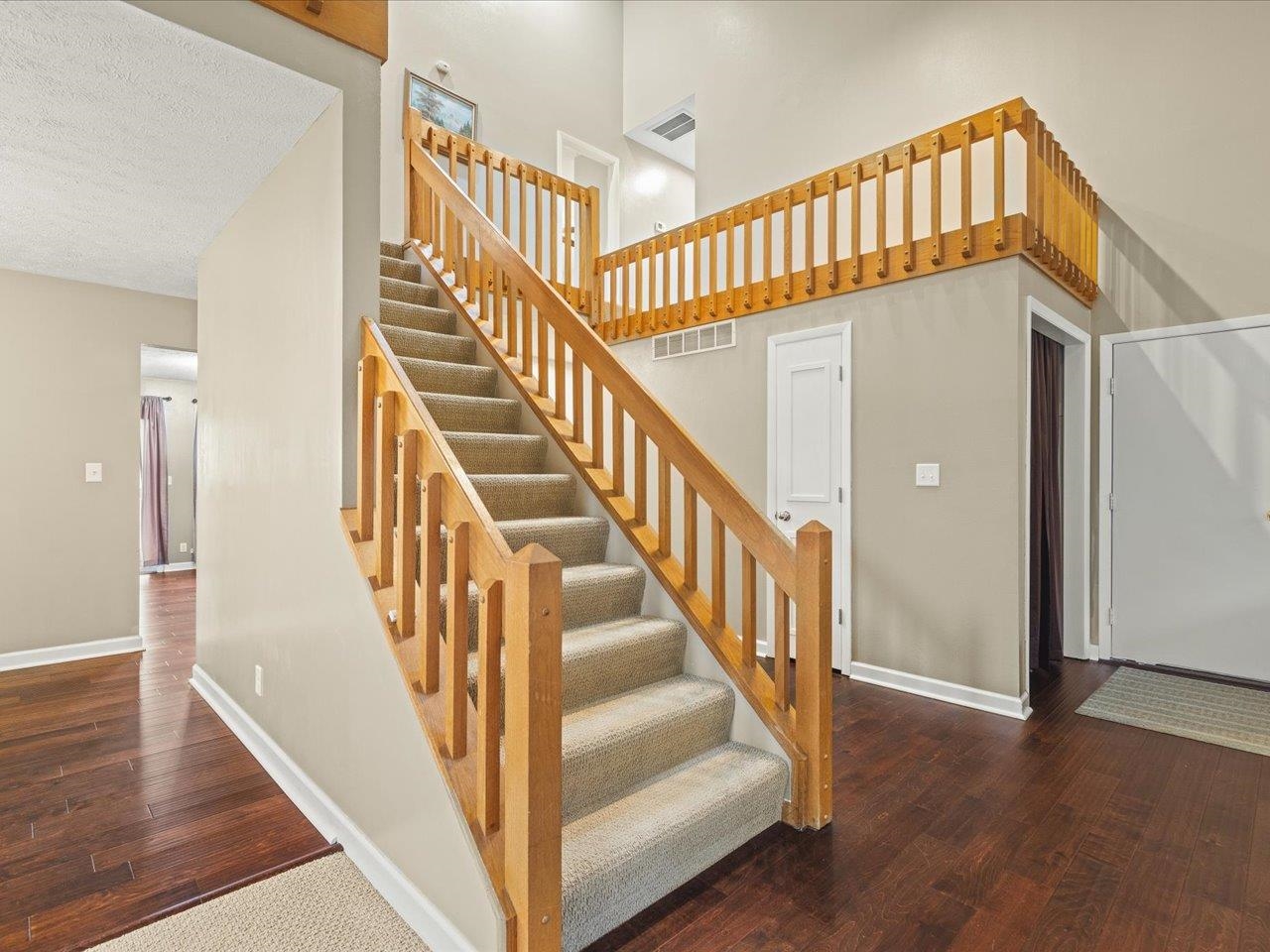 9104 East Weber Road Ridott, IL 61067 - Photo 2 of 96 a view of staircase with wooden floor and stairs