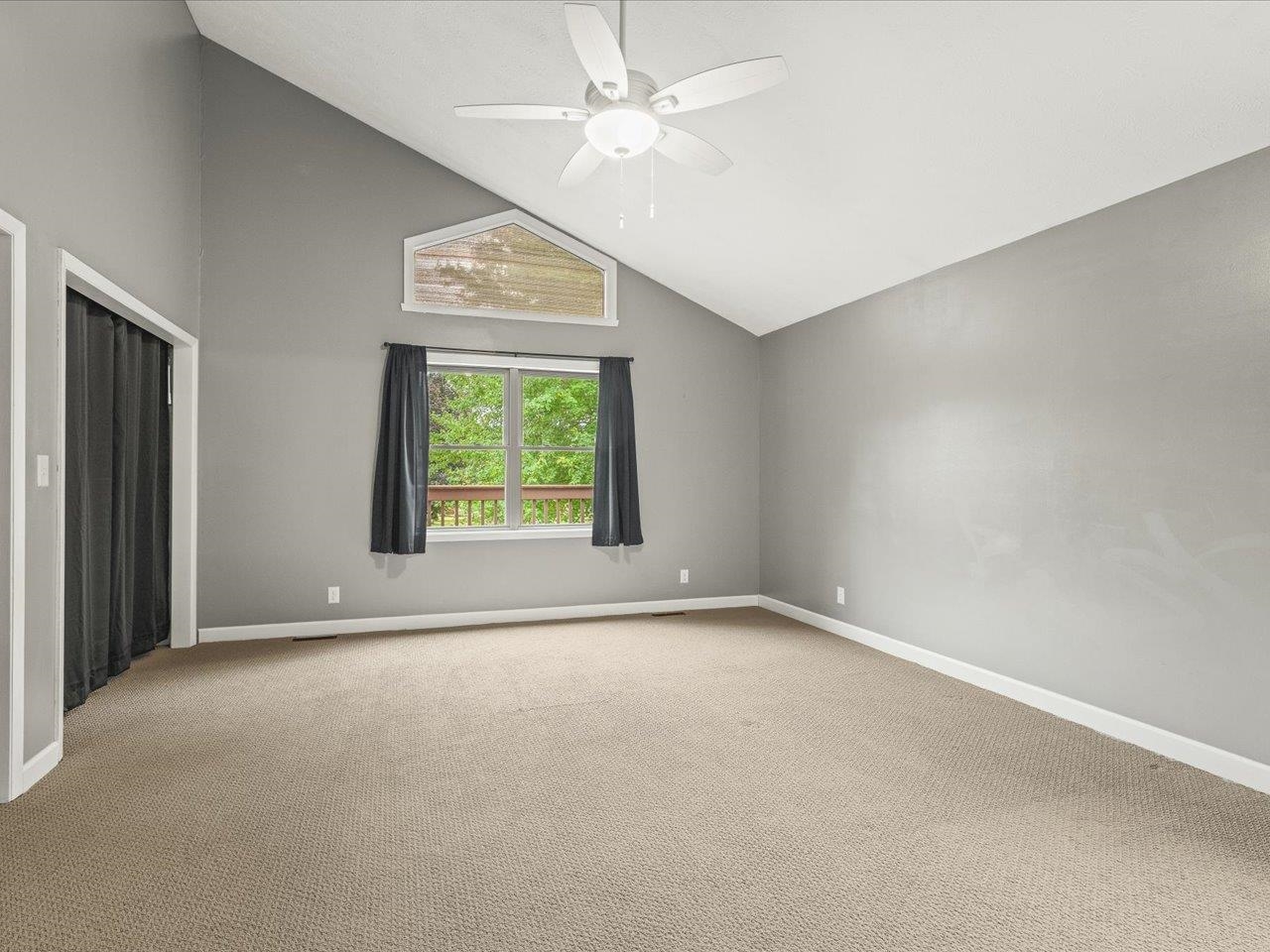 9104 East Weber Road Ridott, IL 61067 - Photo 29 of 96 an empty room with windows and fan